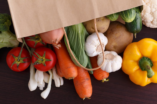 Vegetables on wood background with space for recipe. Organic foo
