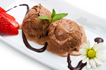 Chocolate ice cream with syrup close up