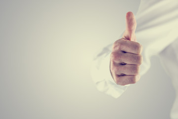 Retro style image of a man giving a thumbs up