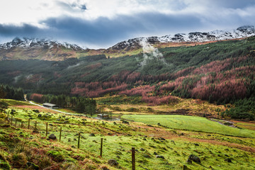 Fototapeta na wymiar Rain clouds over a mountain valley in Scotland