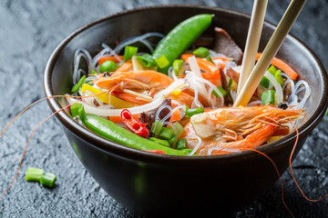 Vegetables served with prawns and noodles