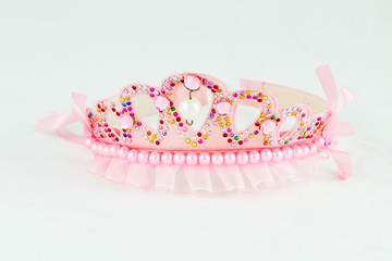pink crown with pink jewels on white background