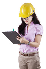 Fototapeta premium Female supervisor making checklist