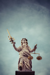Retro style statue of Lady Justice