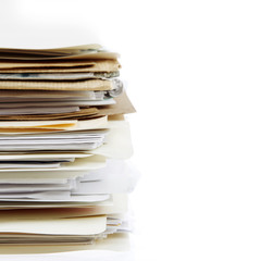 Stacks of files in folders on white. Filing