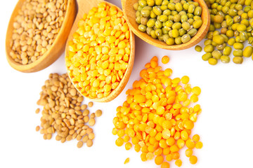 Lentil bean in wooden plate with spice, isolated on white,