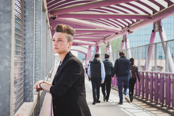 Pretty short hair girl posing on a bridge