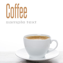 cup of coffee on a white table and space for text