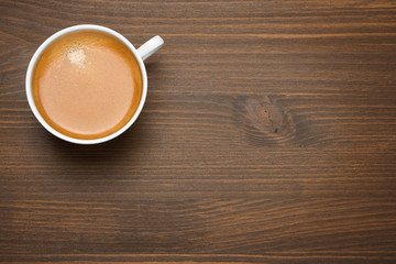 cup of espresso on a wooden background, concept photo