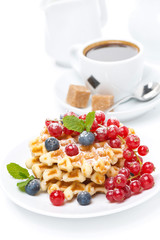 delicious breakfast with Belgian waffles, berries and coffee