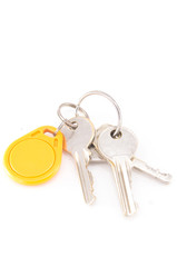 Door keys and circle yellow key card isolated