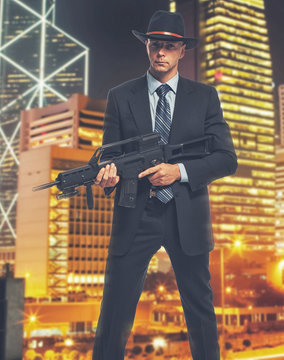 Tall professional killer with a rifel