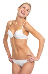 Portrait of laughing young woman in lingerie