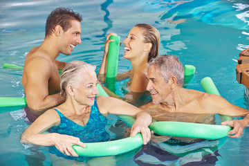 Group in swimming pool doing aqua fitness