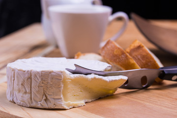 blue cheese and  bread rools on the table