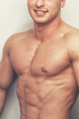 Fototapeta premium Isolated chest photo of a muscled man