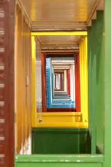 vanishing point perspective on colorful beach hut doors