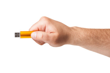 White male hand holding an USA flash drive isolated on white.