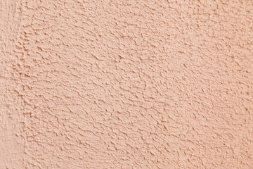 pink limestone textured wall background with selective focus