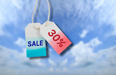 Obraz na płótnie Canvas Sale price tag with cloud and blue sky background