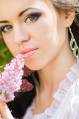 Beautiful young brunette posing in nature