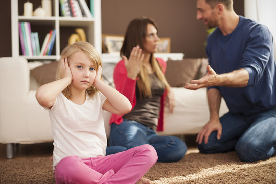 Little girl doesn't want to hear arguing of parents