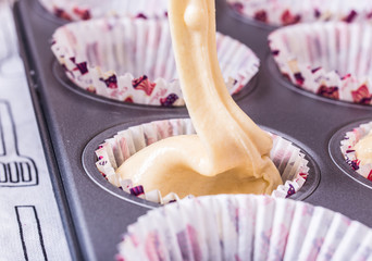 pouring cake mix in to the baking tray