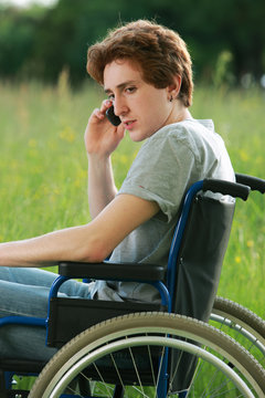 disabled boy with mobile phone