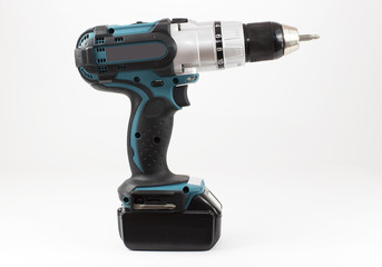 Compact high power cordless drill on the light background