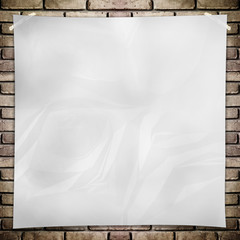 Obraz premium Template- White crumpled square Poster on grunge brick wall