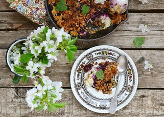 homemade blueberry crumble on  wooden table