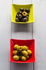 Colorful fruits olives bowls wooden table