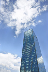 Obraz na płótnie Canvas Office building on blue sky background