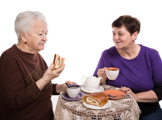 Mother having tea with her daughter