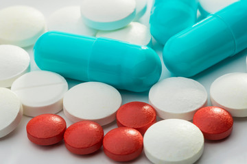 Many colored pills, tablets and capsules for pharmacy and medicine
