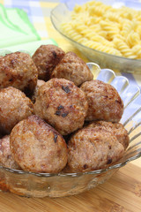Fried pork meatballs in glass bowl
