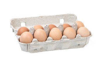 Eggs in a carton isolated on a white background.