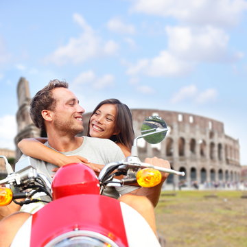 Rome Couple On Scooter By Colosseum, Italy