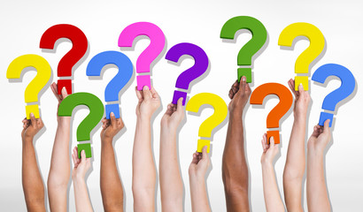 Group of Human Hands Holding Question Marks