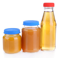 Baby food in glass jars, isolated on white