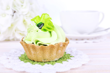 Tasty cake on table on light background