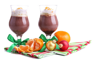 Tasty dessert with chocolate, cream and orange sauce, isolated