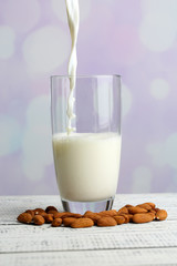 Almond milk is poured into glass,