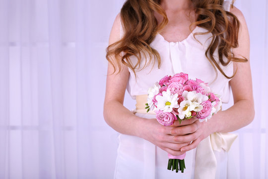 Woman hands holding beautiful wedding bouquet