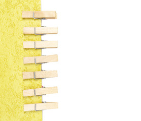 Colorful wooden pins with paper, isolated on white