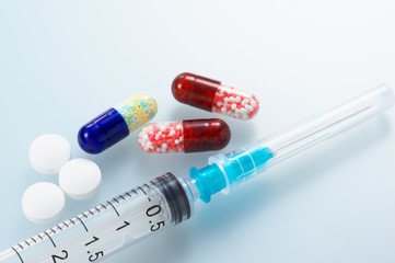 Syringe and medicines. Clean and bright medicine image.
