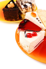 Assortment of pieces of cake, isolated on white © Africa Studio