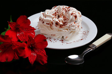 Tasty cake with cream, on black background © Africa Studio