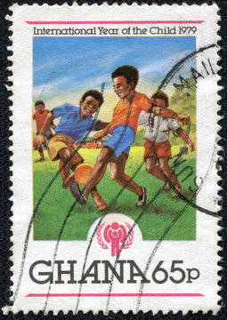 stamp printed in Ghana shows IYC Emblem and Boys playing soccer