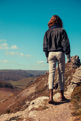 Young woman walking in the mountains